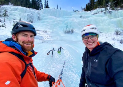Tim Taylor with a female guest on a multi pitch ice climbing day in the David THompson Corridor, Alberta