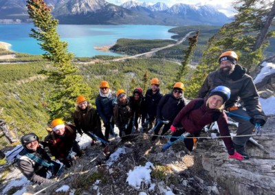 Corporate Team building group climbing the Fox Via Ferrata in Nordegg, Alberta