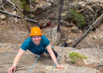 Woman trying top-rope rock climbing on the David Thompson Corridor, near Nordegg, Alberta