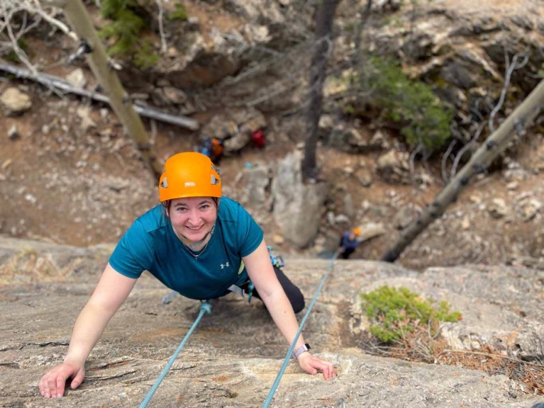Woman trying top-rope rock climbing on the David Thompson Corridor, near Nordegg, Alberta