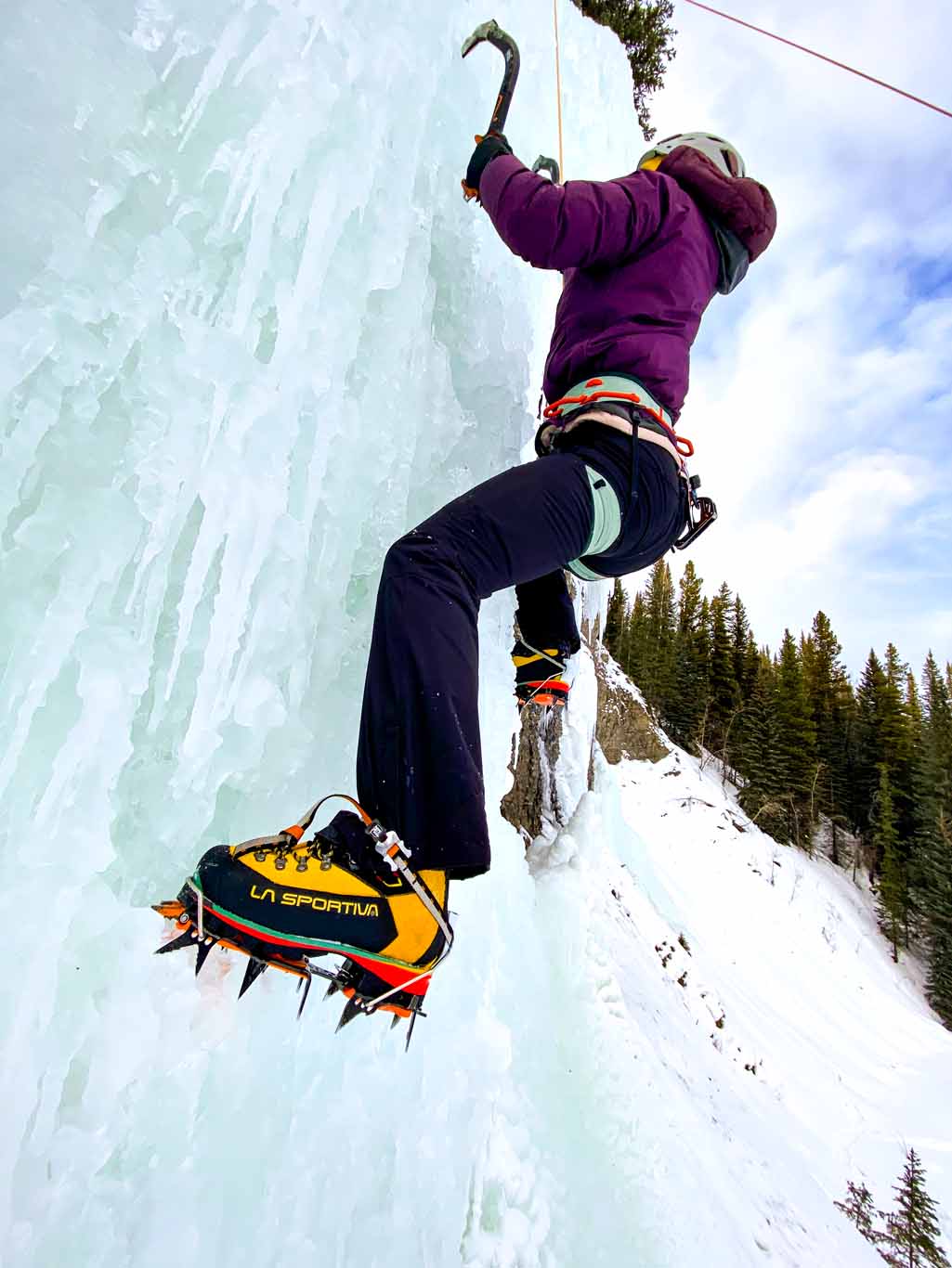 Teenage girl learning to ice climb in David Thompson Country, Alberta