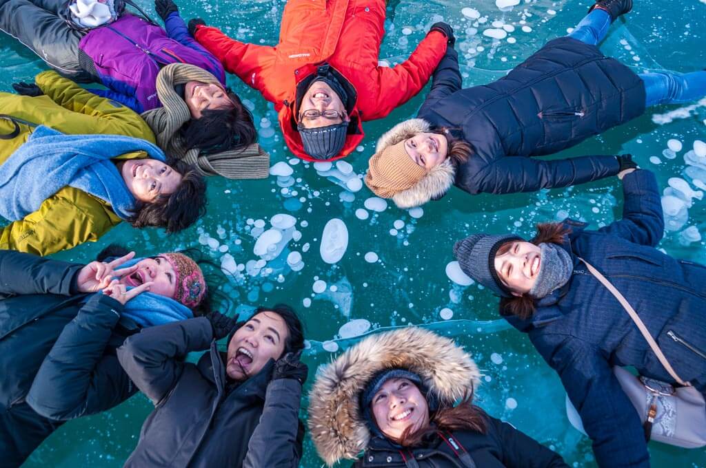 Group of friends with Abraham Lake Ice Bubbles