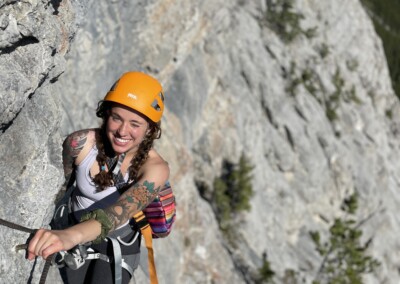 Woman climbing the From Nordegg With Love Via Ferrata in Nordegg Alberta