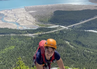 Woman climbing via ferrata in Nordegg, Alberta