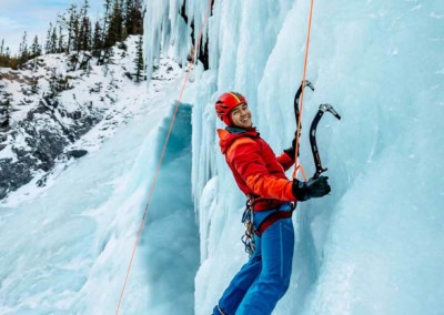 Man ice climbing in the David Thompson Corridor, near Nordegg Alberta
