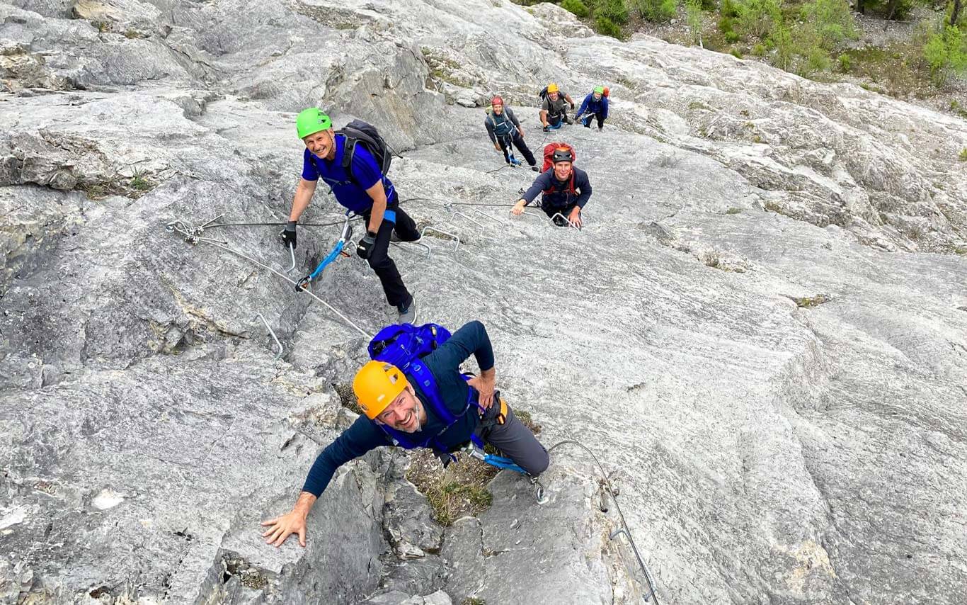 Group of friends climbing the Fox Via Ferrata West of Nordegg, Alberta