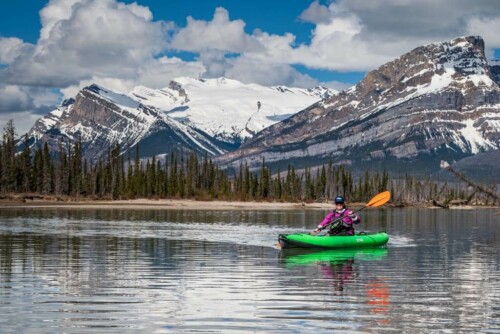 A couple having a picnic at the foot of Coliseum Mountain in Nordegg, alberta