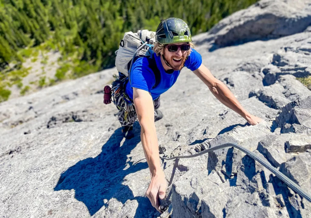 Man climbing the multi pitch climb "better together" in alberta